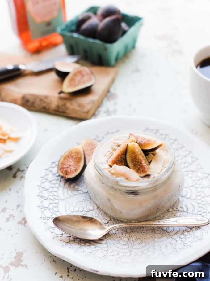 A small jar of fig overnight oats topped with fresh figs.
