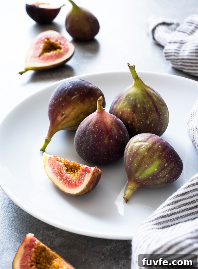 White plate with fresh figs in the center