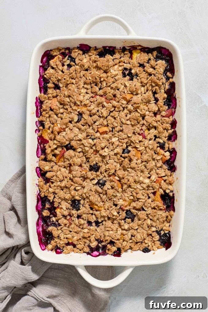 Peach and Blueberry Crisp Recipe with Oat Topping 3 Blueberry and peach crisp in baking dish.