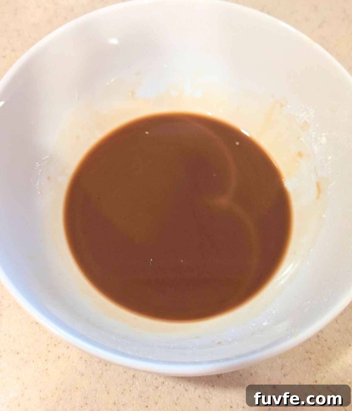Teriyaki sauce in a white bowl