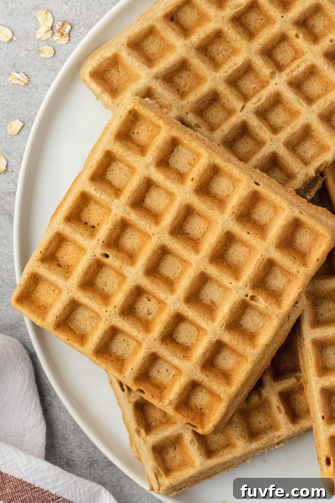 Oatmeal waffles on a white plate