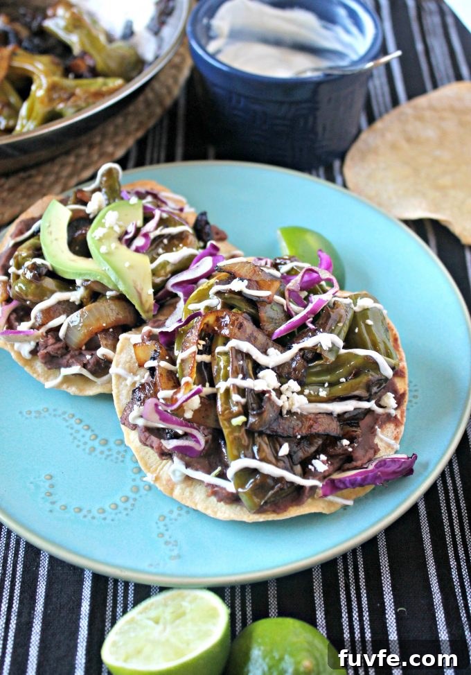 Two shishito tostadas on a blue plate