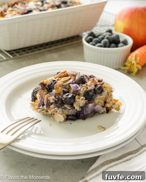 Serving of blueberry morning glory baked oatmeal on a white plate