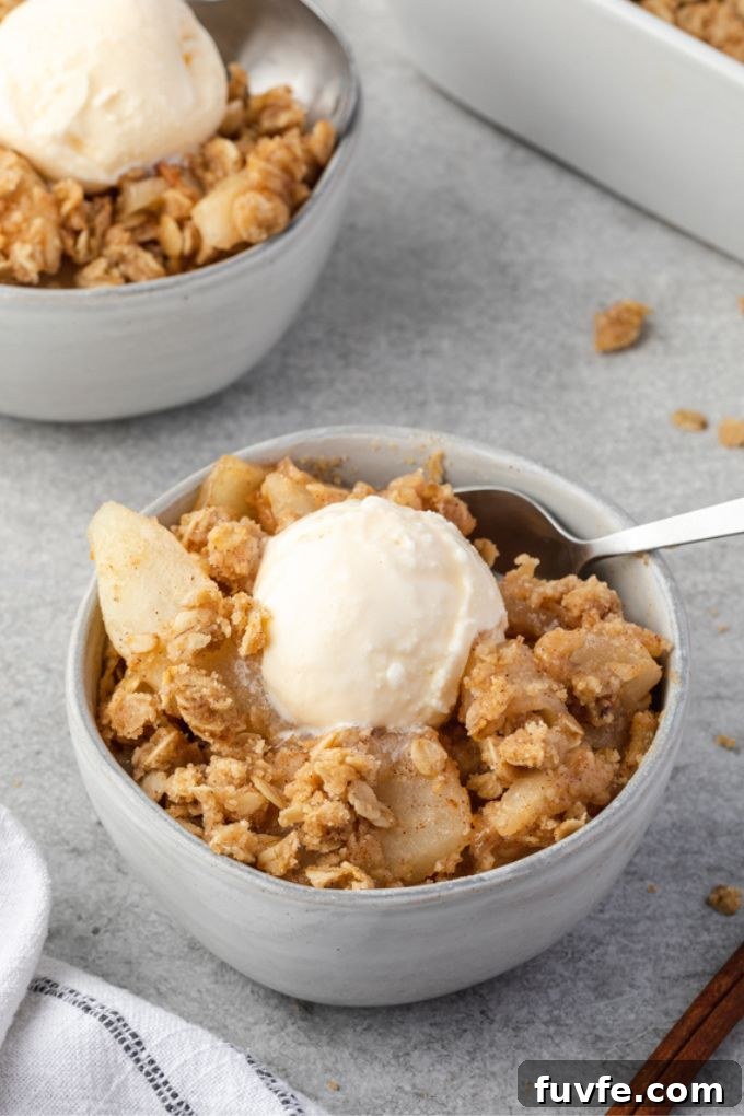 Warm Pear Crumble Recipe with Cinnamon Oat Topping 5 Pear crisp a la mode in a bowl