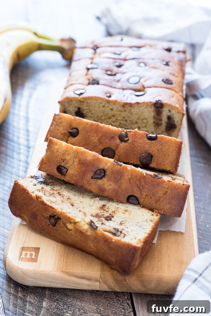 Paleo banana bread sliced on a cutting board