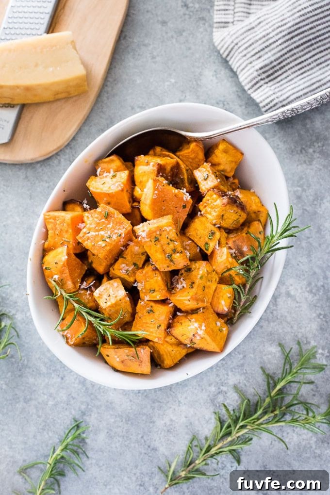 Oven Roasted Sweet Potatoes Recipe with Garlic and Herbs 5 Oven roasted sweet potatoes in a white serving bowl