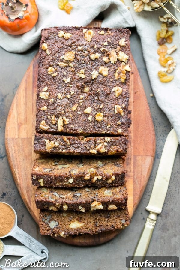 Overhead view of a sliced loaf of persimmon bread.
