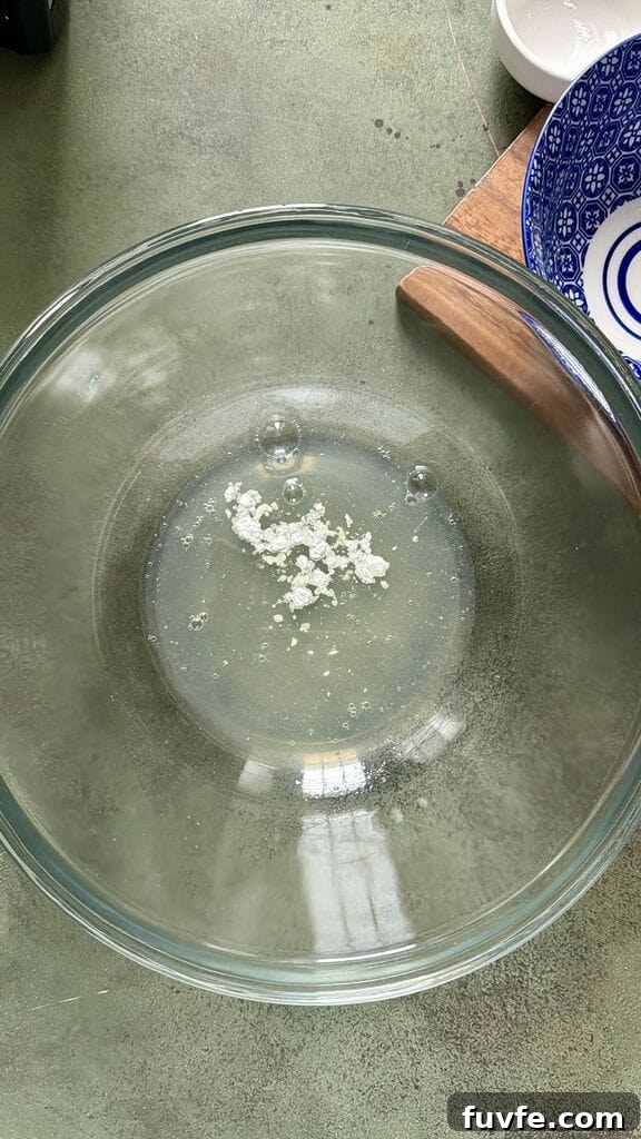 Add the cream of tartar to the egg whites.