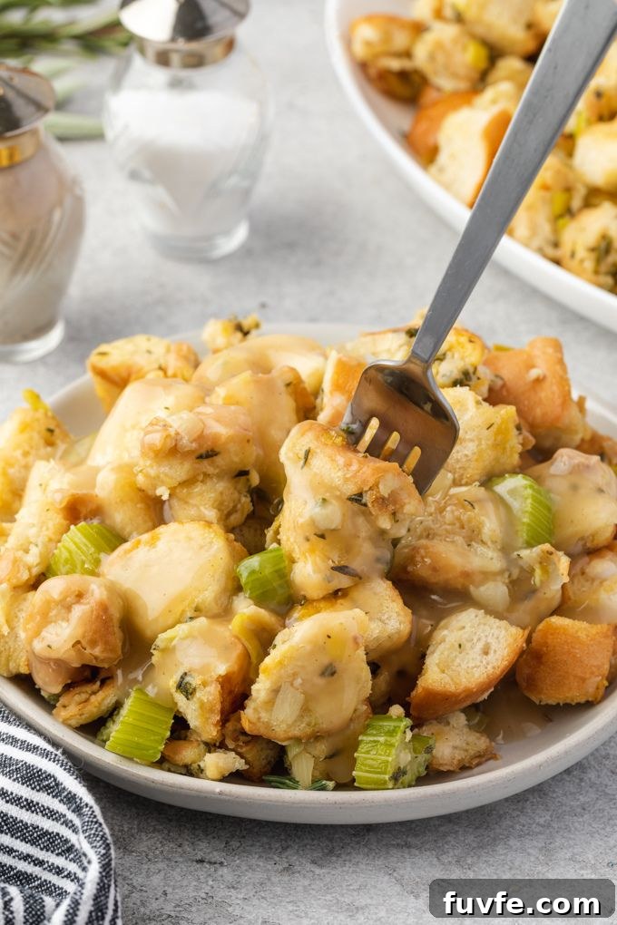 Plate of homemade stuffing on a plate with gravy