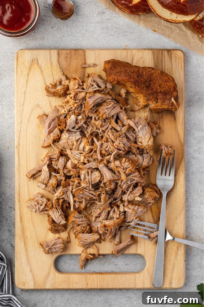 Instant pot pulled pork shredded on a cutting board