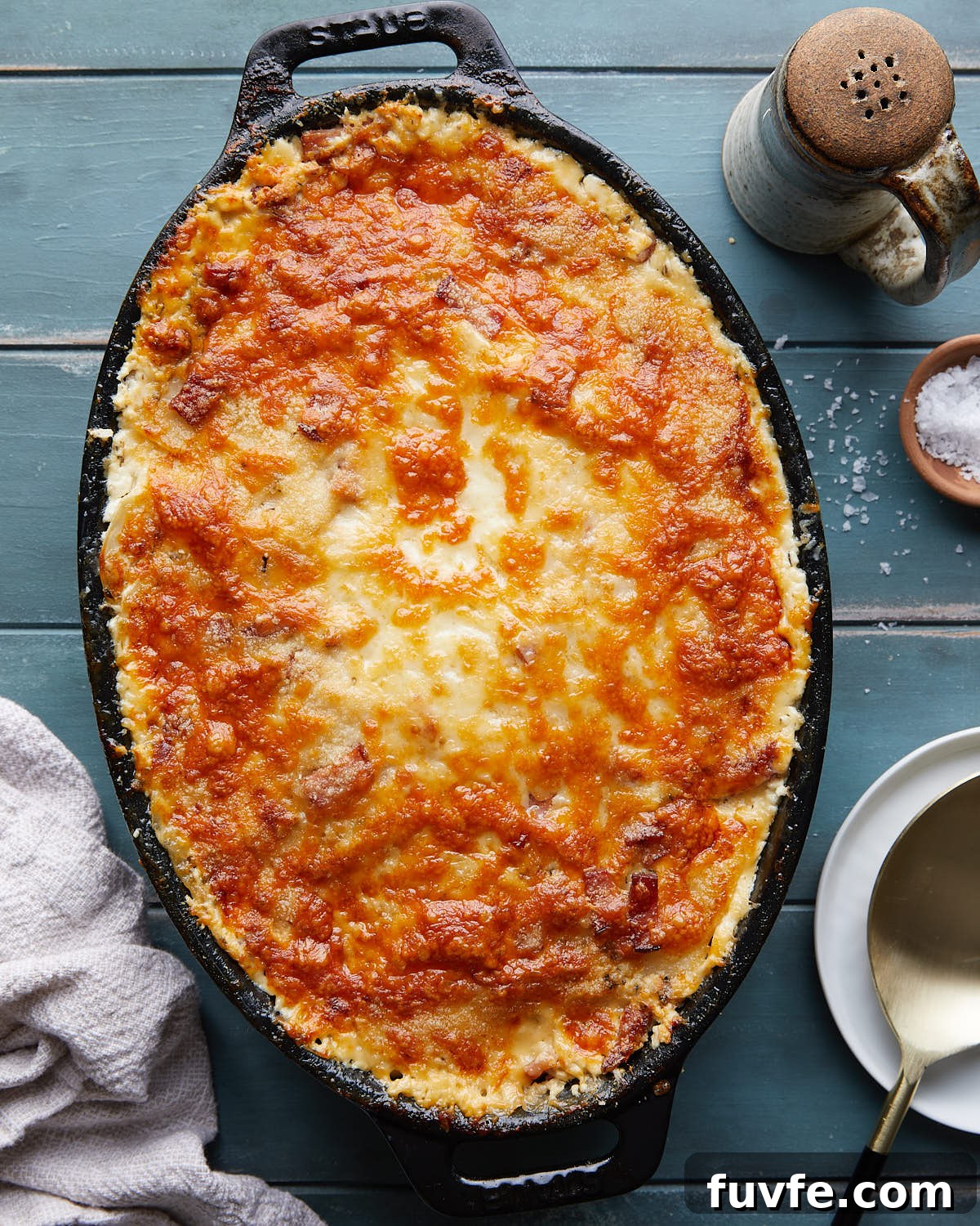Cheesy Ham and Au Gratin Potatoes Recipe 2 Overhead image of au gratin potatoes in black cast iron dish.