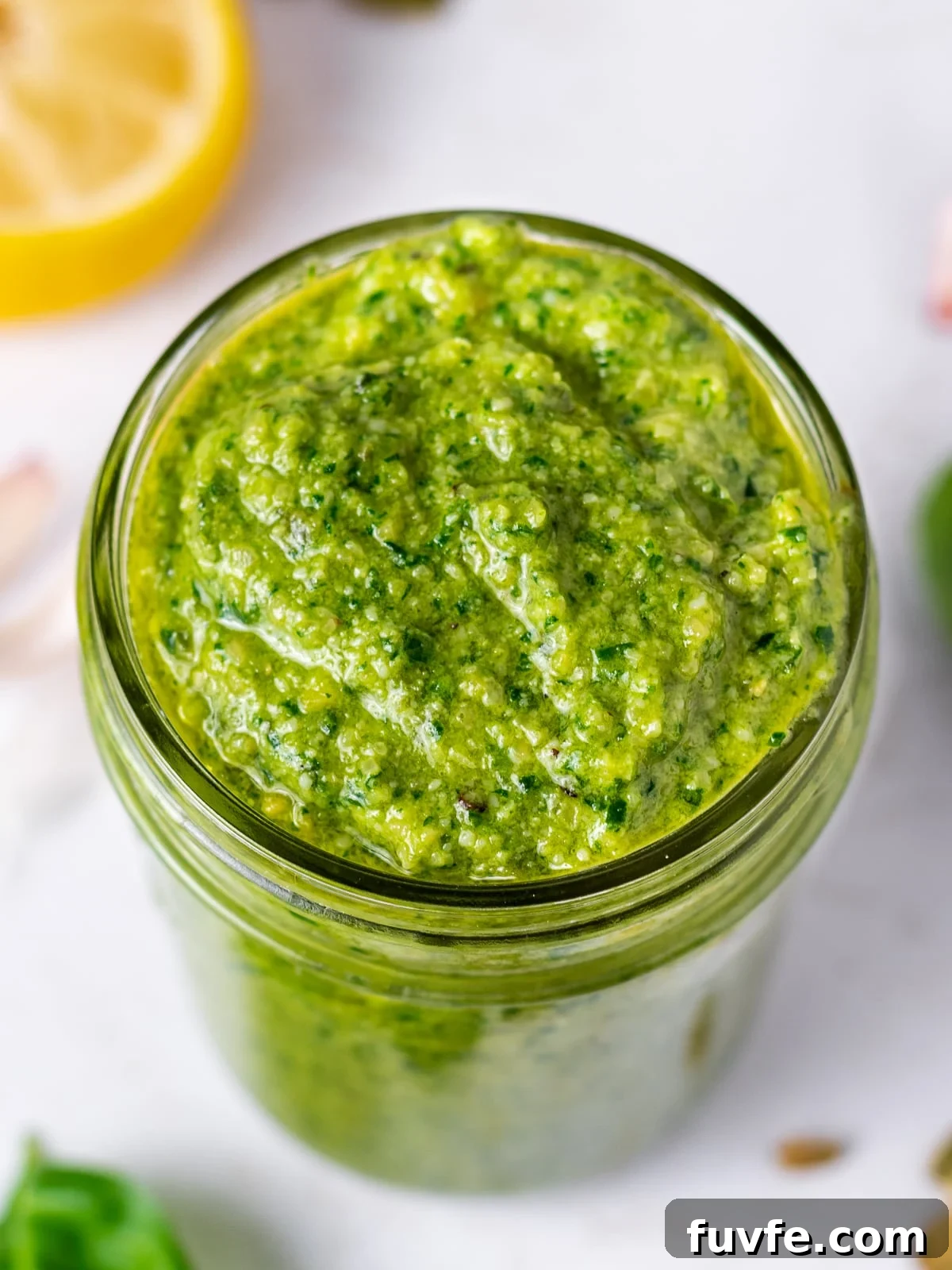 Pepita Pesto Recipe: Nutty Pumpkin Seed Sauce for Pasta & Toast 8 close up of a jar of green pepita pesto