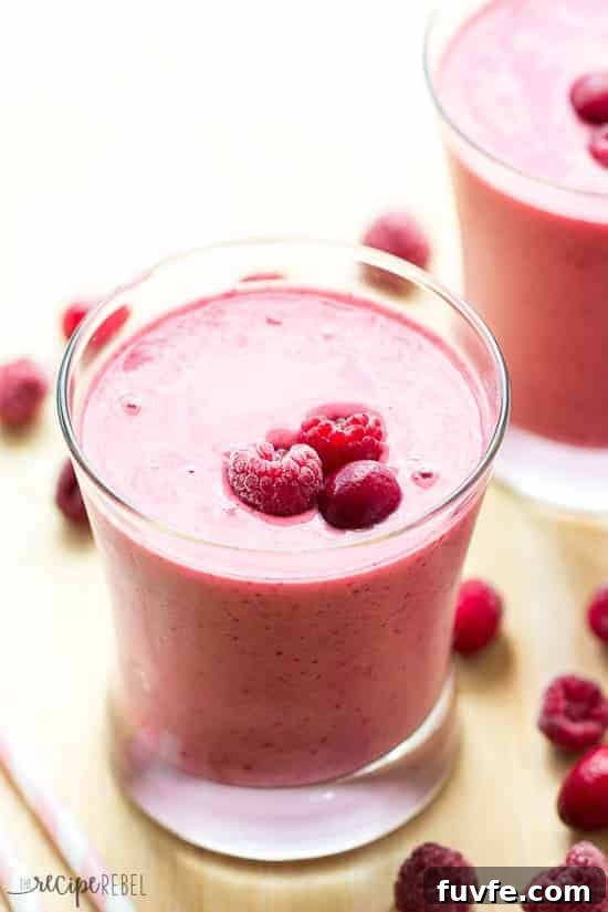 A glass of cranberry raspberry smoothie.