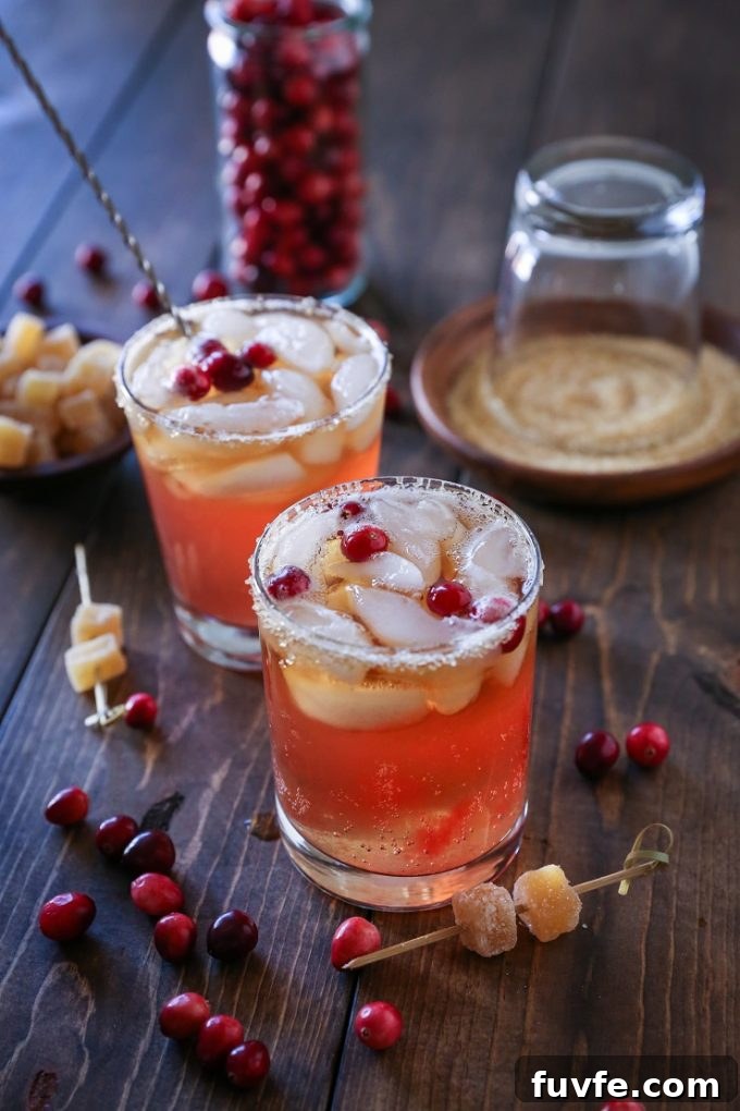 Two cranberry dark and stormy cocktails.