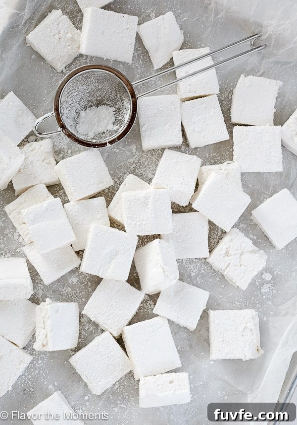 Homemade marshmallows scattered on waxed paper