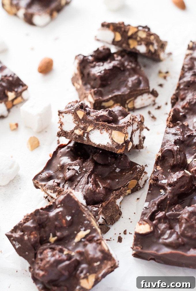 Squares of homemade rocky road on parchment paper