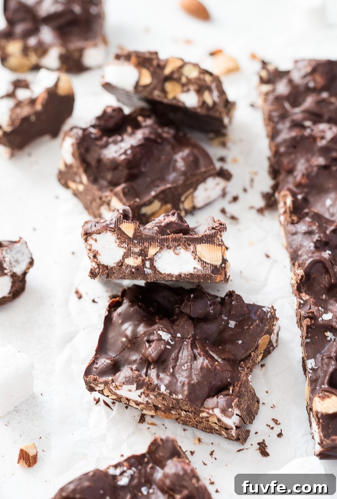 Squares of rocky road candy on parchment paper