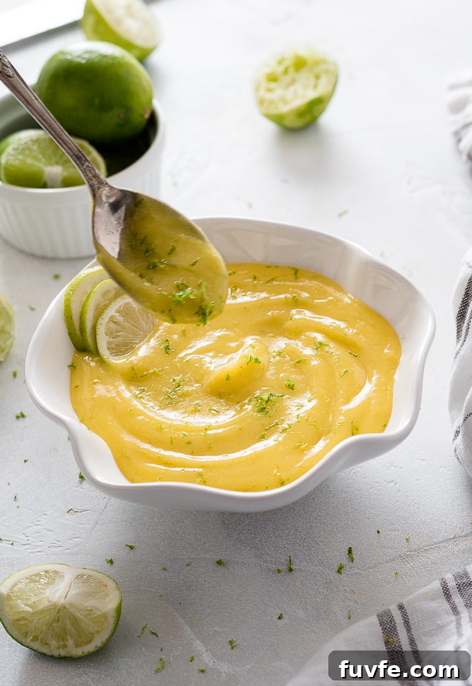 Spoon over a bowl of lime curd