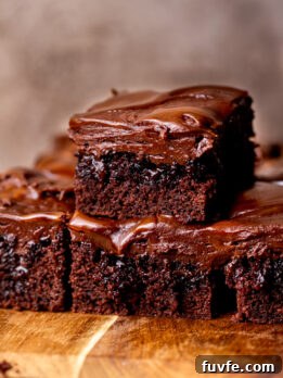 Decadent Chocolate Caramel Cake Recipe for Special Occasions 11 Stack of two chocolate caramel cake slices.