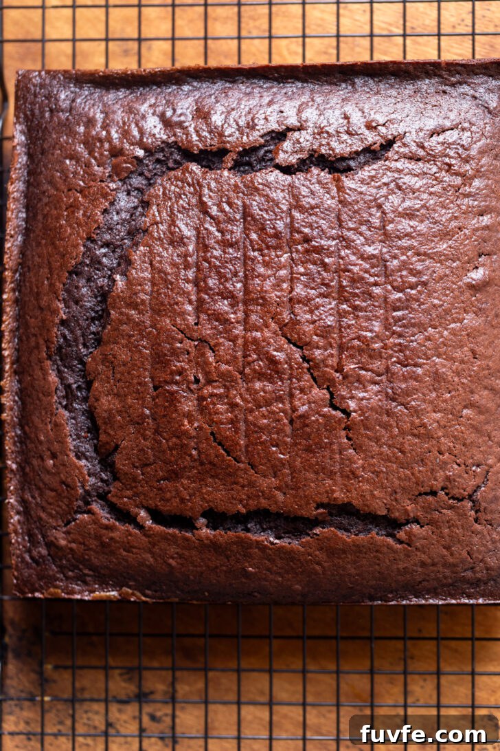 Decadent Chocolate Caramel Cake Recipe for Special Occasions 5 Cake on a wire rack.