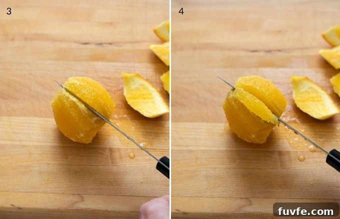 Knife segmenting an orange slice