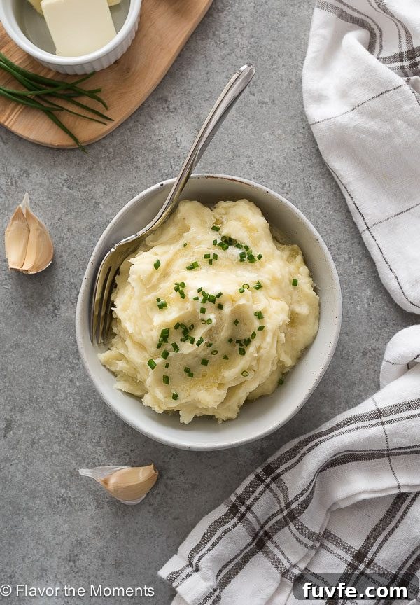 Overhead shot of instant pot mashed potatoes in bowl with fork
