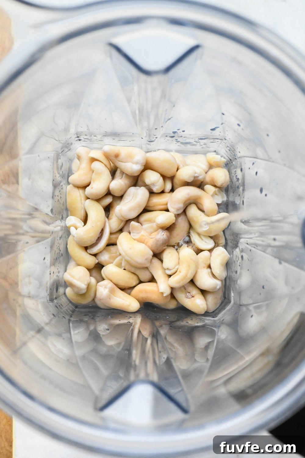 How to make cashew cream: Soaked cashews in blender container with water before blending.