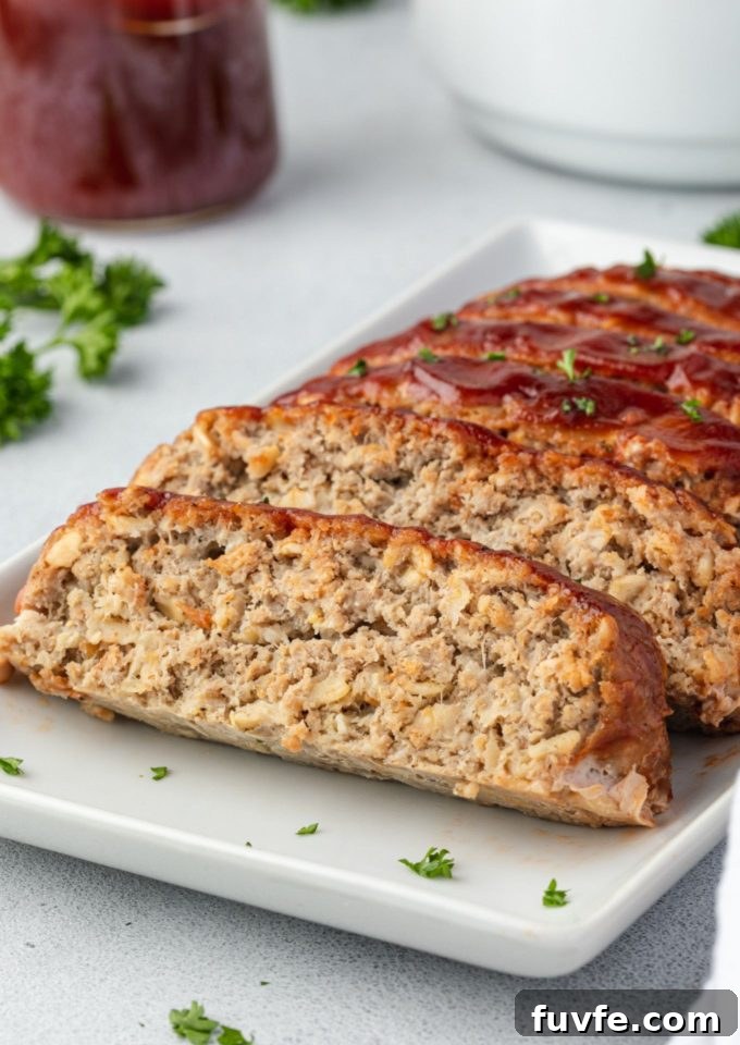 Smoky Barbecue Turkey Meatloaf with Oats 2 BBQ turkey meatloaf sliced on a platter