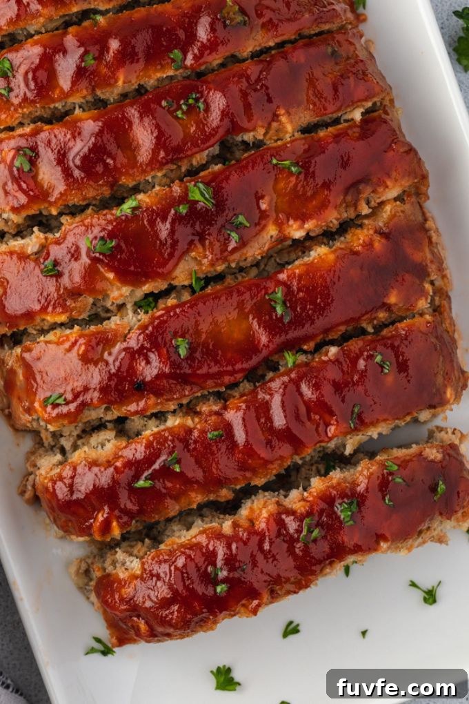 Smoky Barbecue Turkey Meatloaf with Oats 3 Sliced turkey meatloaf with oatmeal on a platter