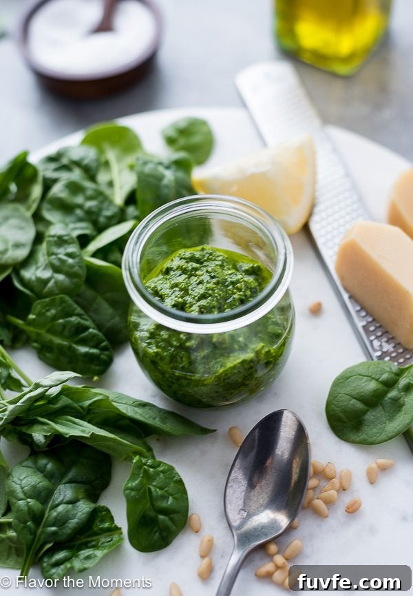 Pesto Sauce Recipe Using Any Greens 2 Pesto sauce in jar with greens and parmesan alongside