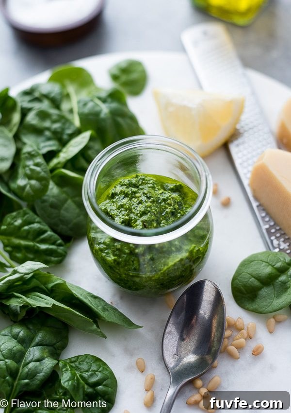 Pesto Sauce Recipe Using Any Greens 3 Homemade pesto sauce in a jar next to fresh greens