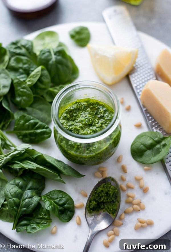 Pesto Sauce Recipe Using Any Greens 7 Homemade pesto sauce in jar with spinach, pine nuts and parmesan