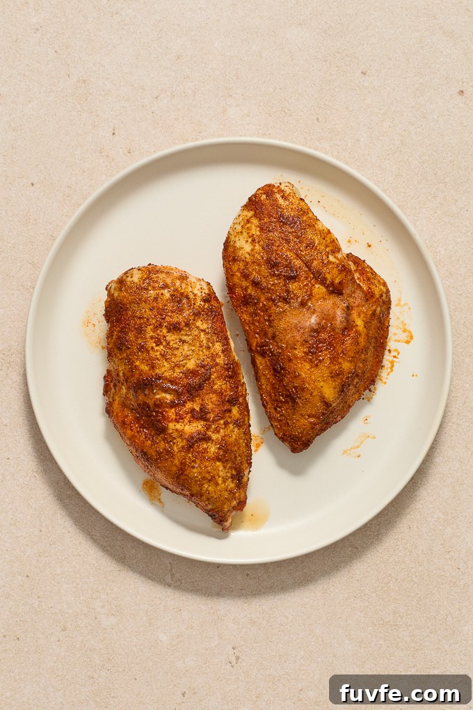 Cooked grilled chicken on a plate.