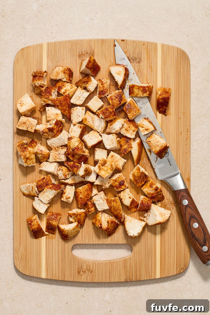 Chopped chicken breast on a cutting board.