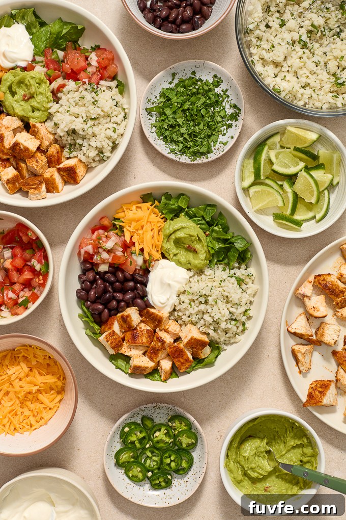 Assembled chicken burrito bowls with cilantro lime cauliflower rice.