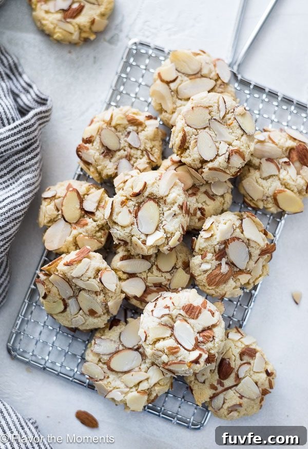 Greek almond cookies piled on wire rack