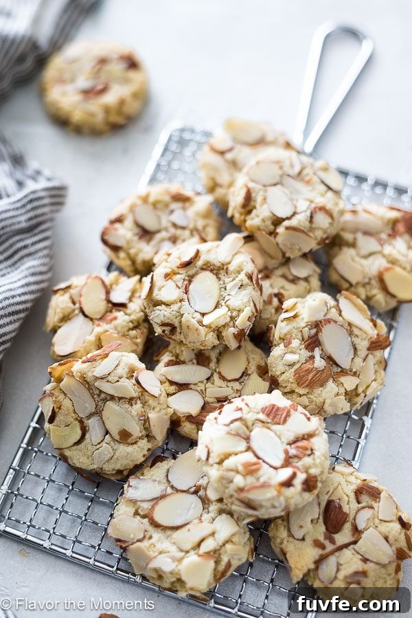 Greek almond cookies piled on wire rack front view shot