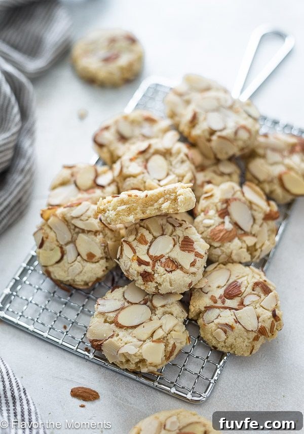 Cookies on baking rack -- cookie on top has bite out of it