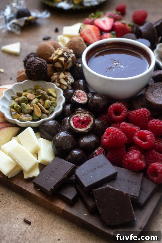 Chocolate Dessert Charcuterie Board Ideas for Parties 7 Chocolate charcuterie board with a variety of chocolate treats, chocolate ganache and fruits.