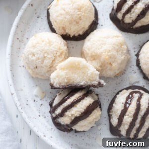 Coconut macaroons on a plate with one cut in half