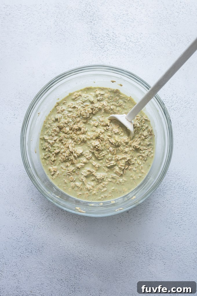 Matcha Overnight Oats Recipe: Creamy No-Cook Breakfast 6 Matcha coconut overnight oats in bowl before chilling.