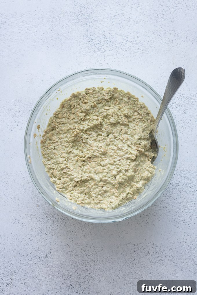 Matcha Overnight Oats Recipe: Creamy No-Cook Breakfast 7 Finished matcha overnight oats in mixing bowl.