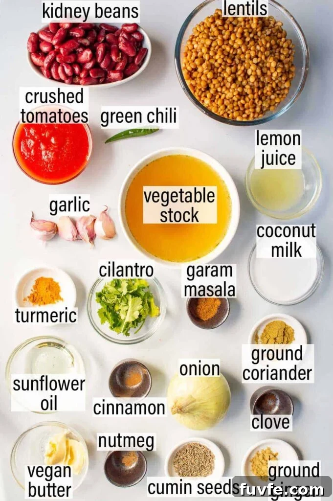 Labelled ingredients for vegan dal makhani including kidney beans, lentils, crushed tomatoes and spices.