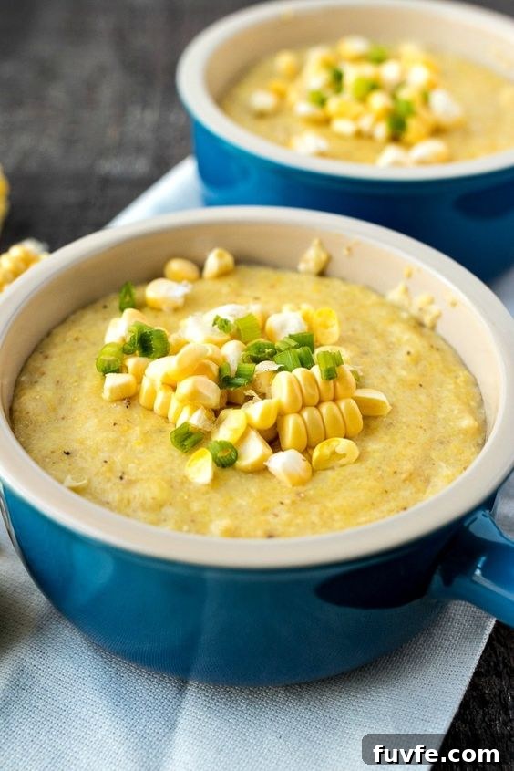 Two blue ramekins of goat cheese sweet corn grits.
