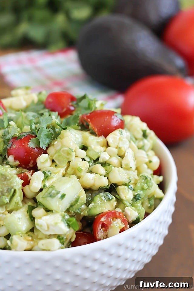Bowl of grilled corn and avocado salad