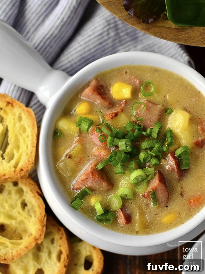 White ramekin of sweet corn and kielbasa soup.