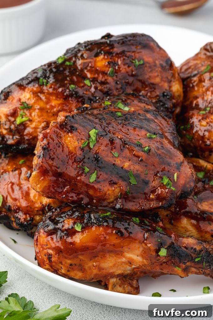 Juicy Smoky Grilled BBQ Chicken Recipe 8 Platter of barbecued chicken garnished with parsley