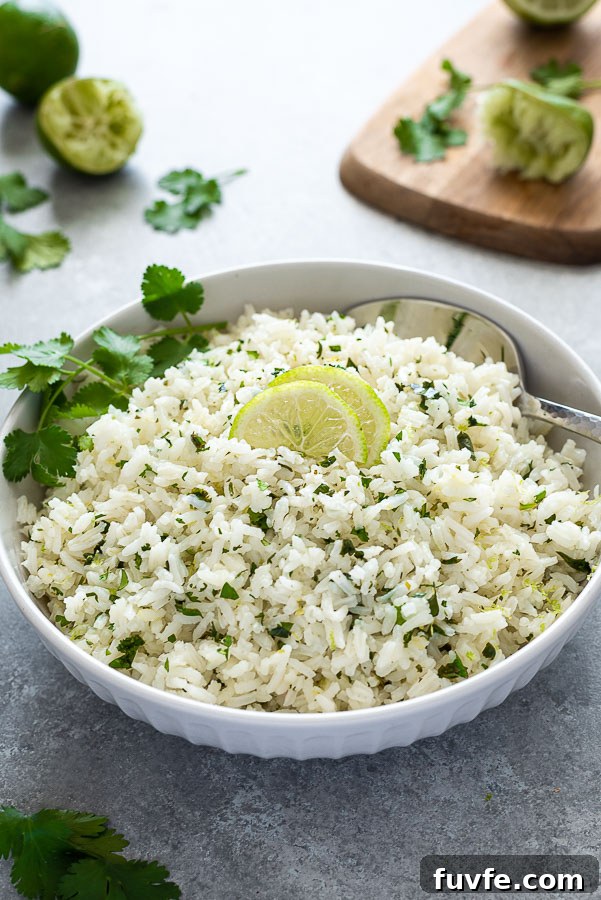 front shot of bowl of cilantro lime rice with cutting board in background