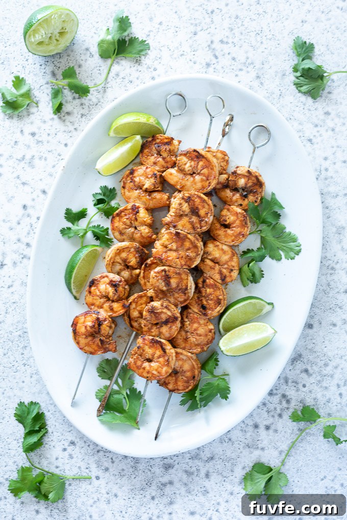 Grilled Chili-Lime Shrimp Skewers Recipe 3 Platter of grilled shrimp skewers with lime and cilantro