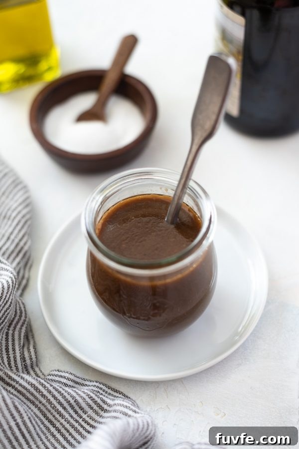 Homemade Balsamic Vinaigrette Recipe 2 balsamic vinaigrette dressing in a jar with a spoon